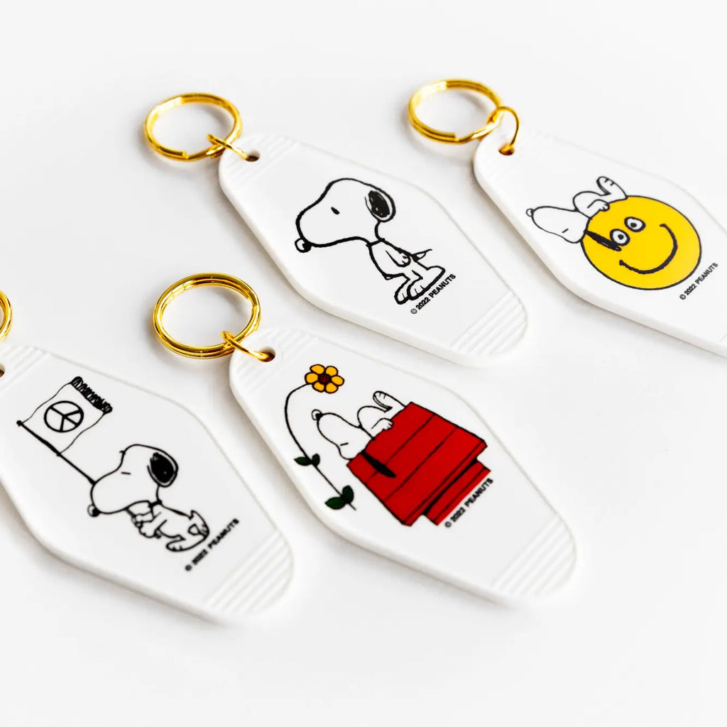 Peanuts Snoopy Doghouse Flower Key Tag - A charming key accessory featuring Snoopy's doghouse and blooming flowers for added whimsy.