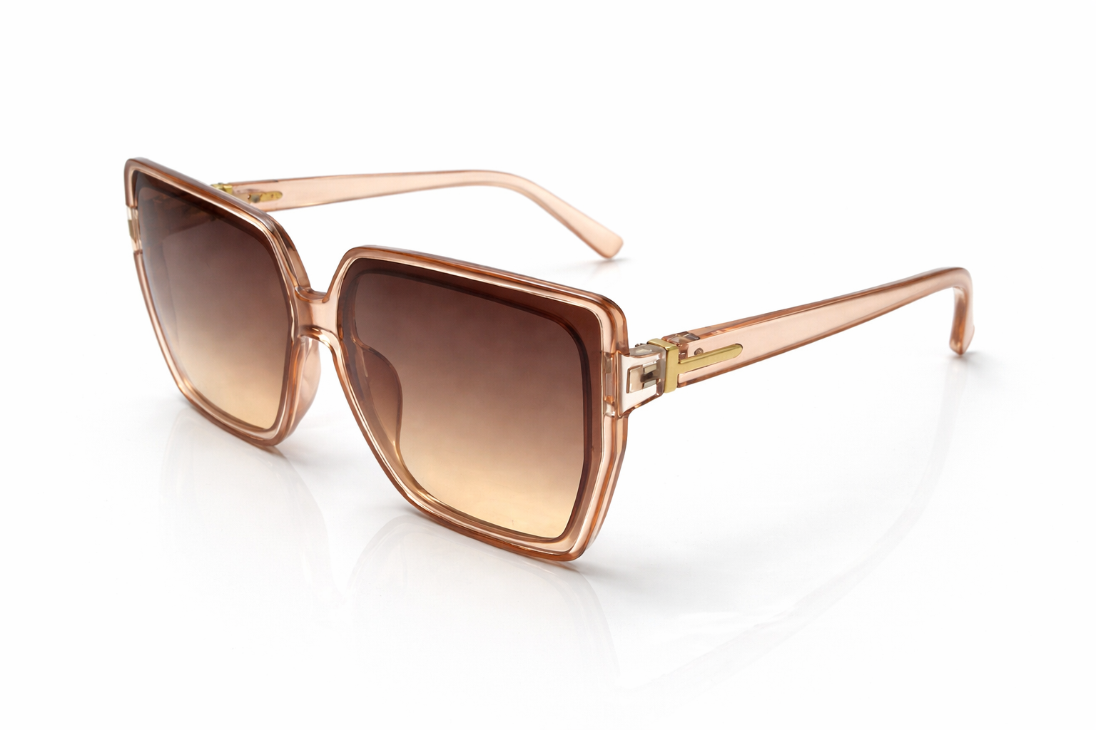 Sunglasses with rose gold frame and brown gradient lenses on a white background