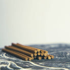 Elegant blue box of natural incense sticks with embossed detailing and a built-in holder, perfect for relaxation and mindfulness.