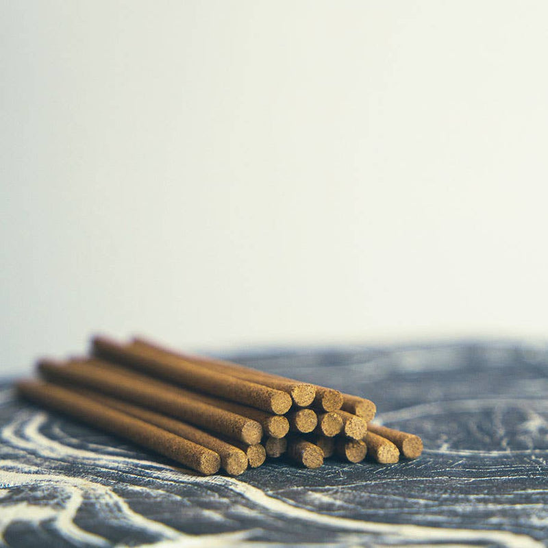 Elegant blue box of natural incense sticks with embossed detailing and a built-in holder, perfect for relaxation and mindfulness.