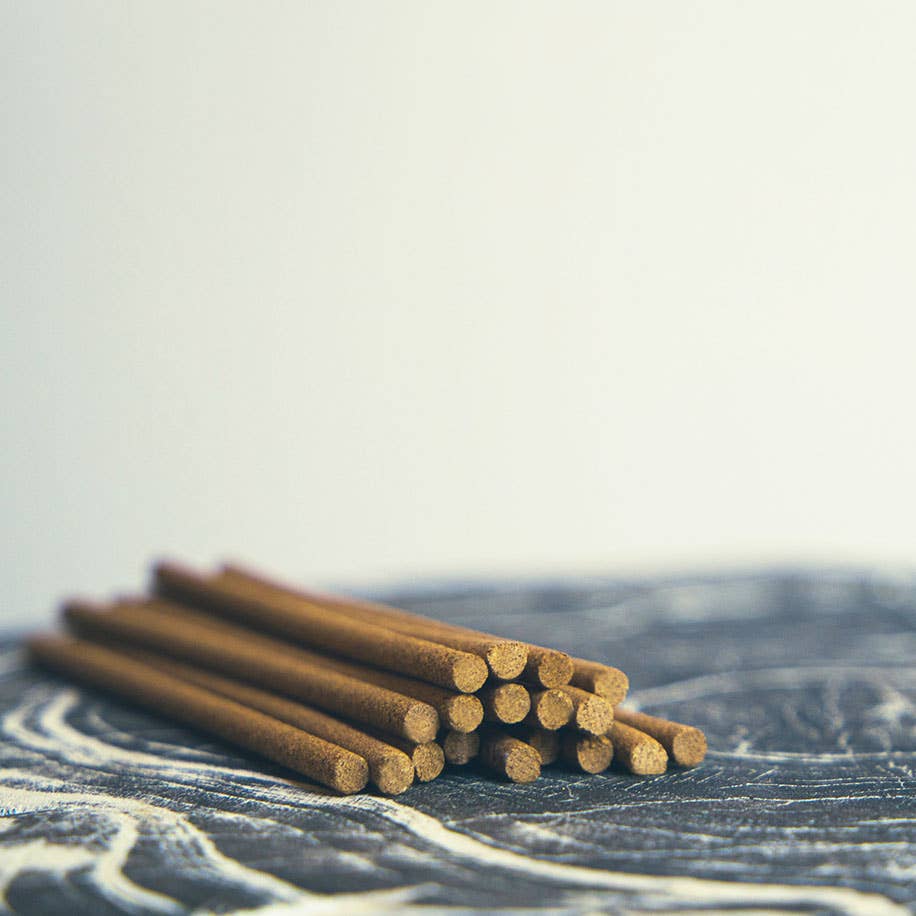 Elegant blue box of natural incense sticks with embossed detailing and a built-in holder, perfect for relaxation and mindfulness.