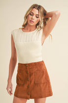 A high-neck tank top named "Hazel".