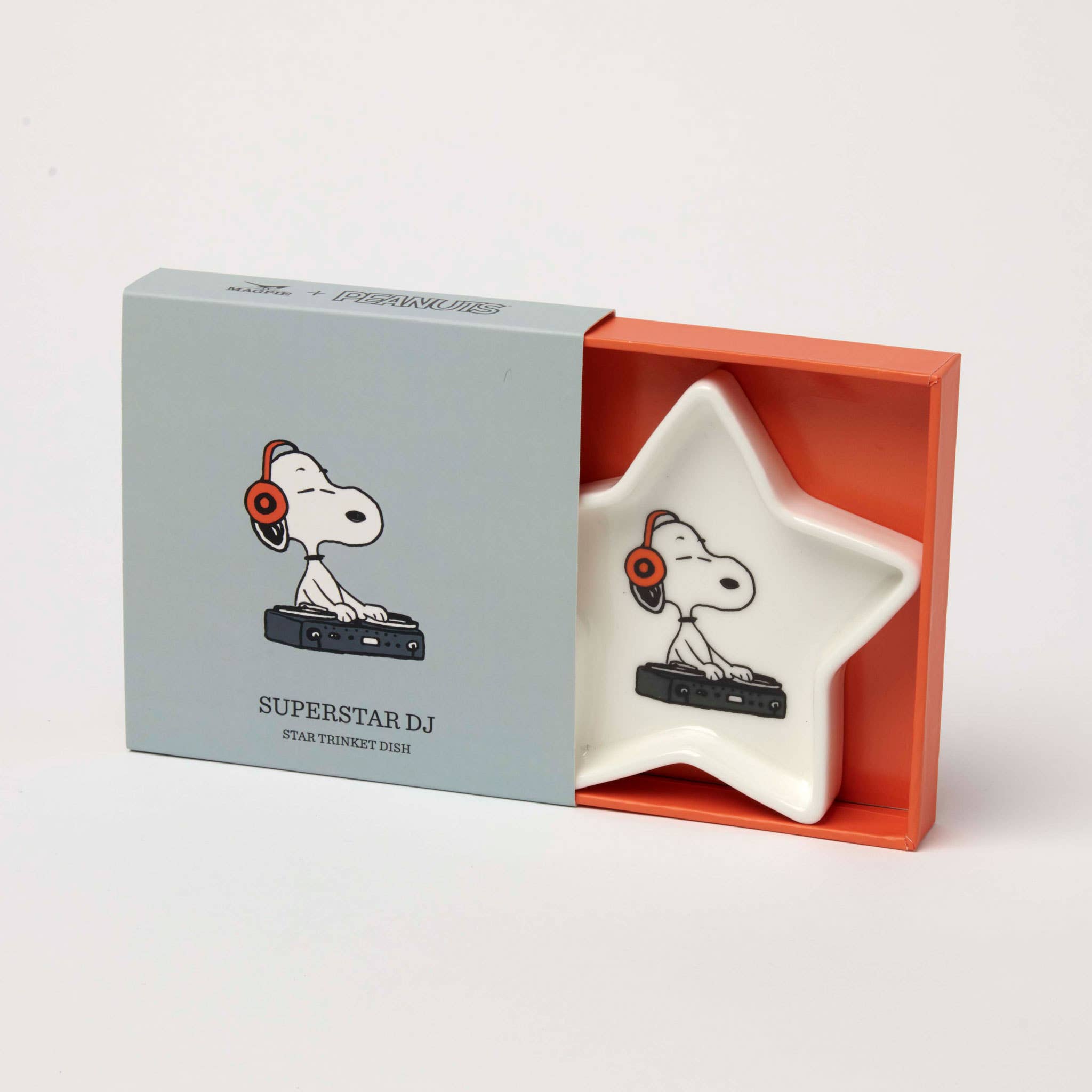Star-shaped ceramic trinket dish with a DJ wearing headphones and using a turntable, packaged in a blue and orange gift box.