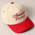 Corduroy trucker baseball cap with "American Honey" embroidered in red on cream and red fabric.