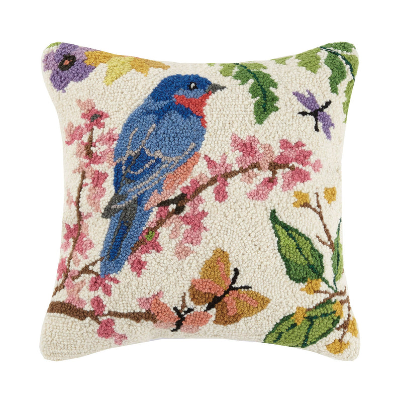 Bluebird hook pillow with a vibrant bird perched on a floral branch, featuring detailed wool embroidery.