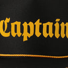 Black cap with 'Captain' embroidered in yellow on a black background