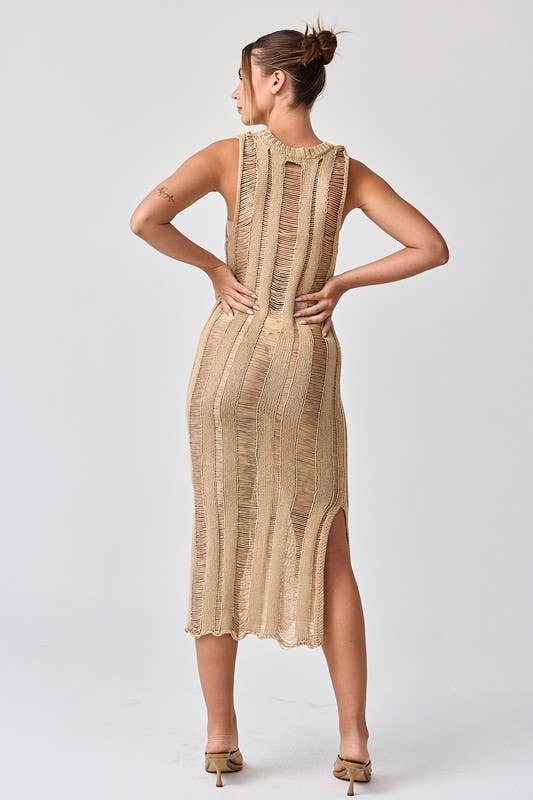 Woman wearing a sleeveless ladder knit midi dress.