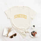 Sunkissed T-Shirt: White shirt with a large sun design.