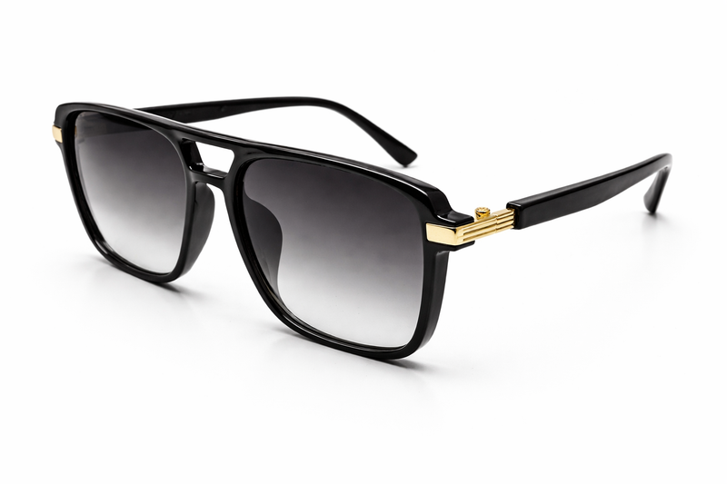 Black sunglasses with gold accents on a white background