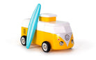 Toy Volkswagen camper van with a surfboard on a white background