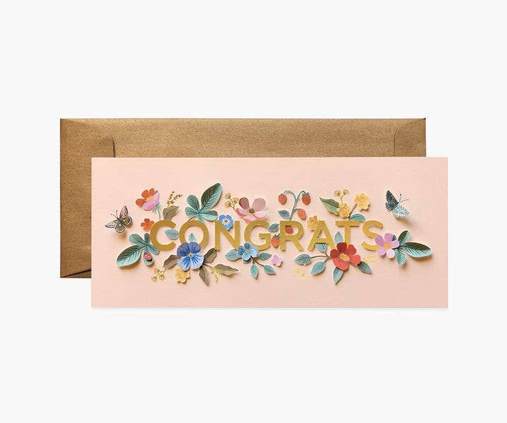 A congratulations card with colorful floral designs and gold "Congrats" lettering, paired with a gold envelope.