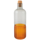 Glass bottle with cork stopper on a white background