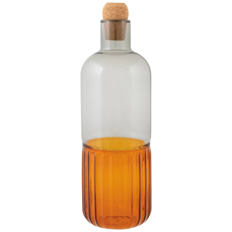 Glass bottle with cork stopper on a white background