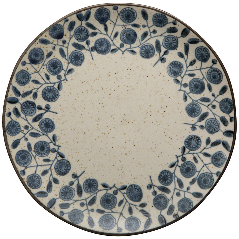 Round ceramic plate with blue floral pattern on a white background