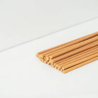 Gaia natural incense sticks in a terracotta box with an embossed tree design and built-in holder for relaxation and grounding.