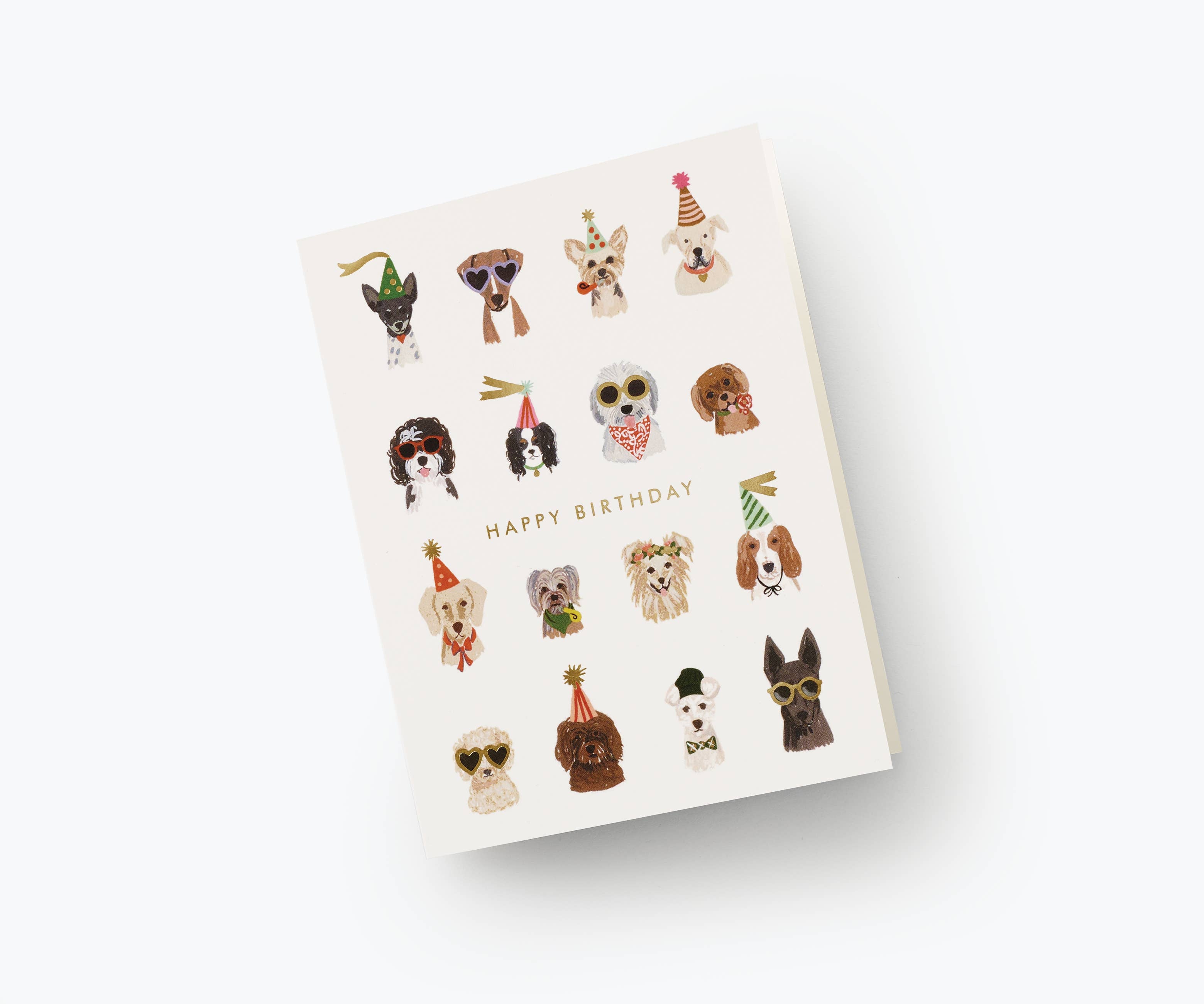 Cute dog-themed birthday card with illustrated pups wearing party hats and sunglasses, paired with a gold envelope.
