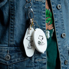 Peanuts® Snoopy Tennis Coin Pouch featuring Snoopy holding a tennis racket.