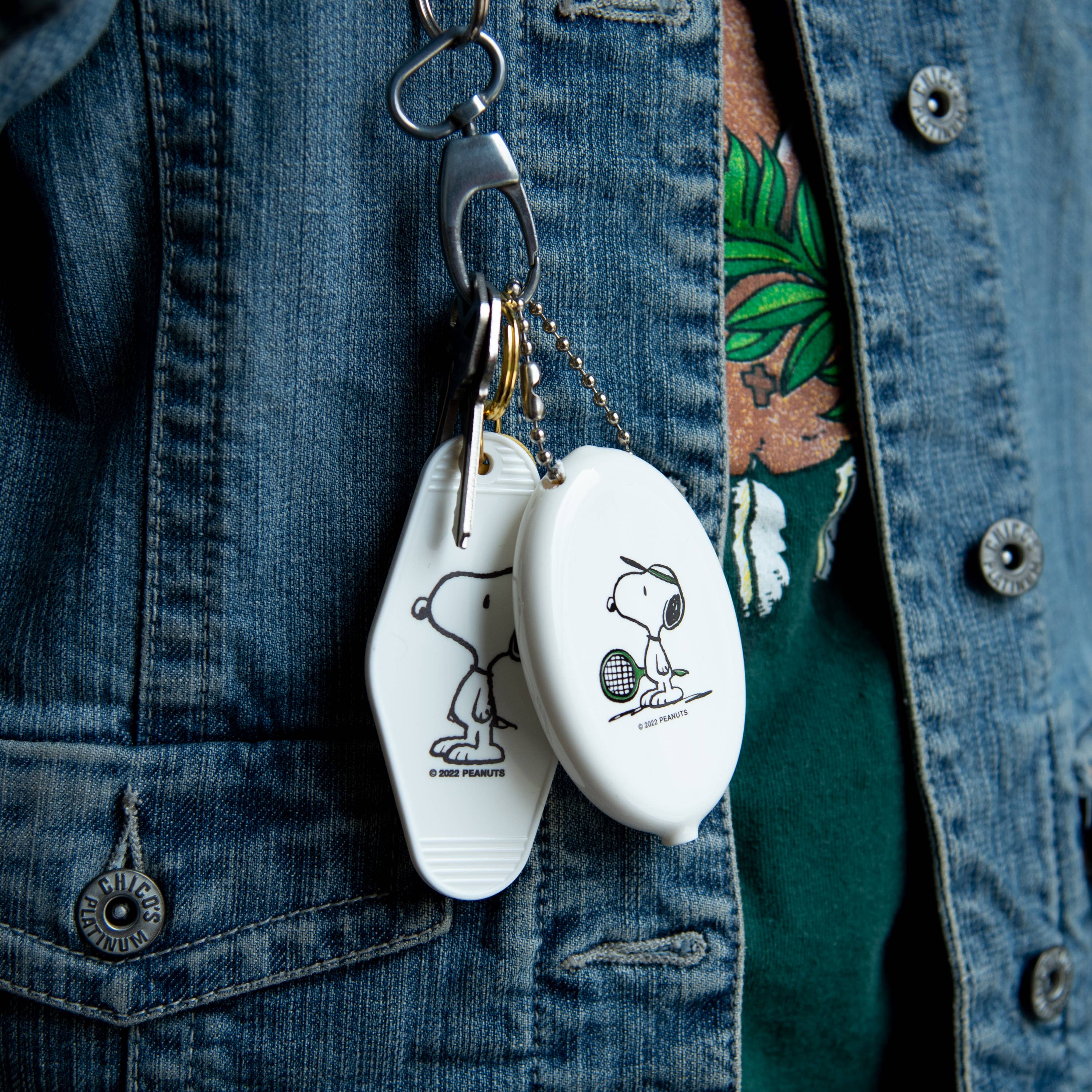 Peanuts® Snoopy Tennis Coin Pouch featuring Snoopy holding a tennis racket.