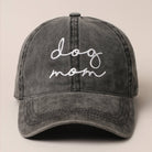 Gray cap with 'dog mom' embroidery on a beige background