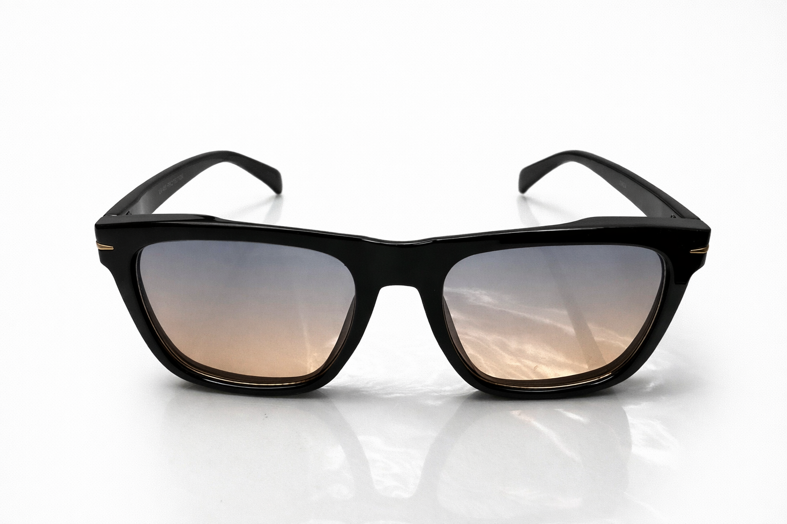 Black sunglasses with reflective lenses on a white background