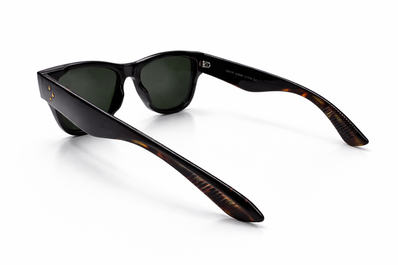 Sunglasses with black frame and tortoiseshell arms on a white background