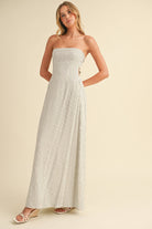 Back-tie strapless striped maxi dress with full-length skirt and bow detail