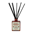 Hawai‘i Volcanoes reed diffuser with amber bottle and black reeds by Good & Well Supply Co., featuring wild fig, ginger, and citrus.