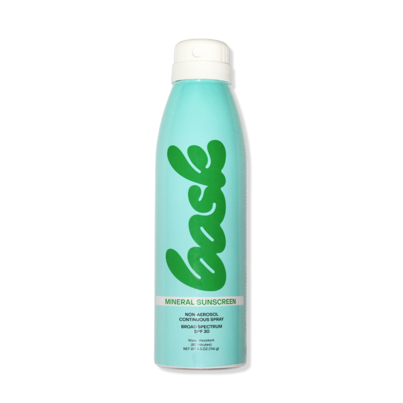A bottle of Bask SPF 30 Mineral Non-Aerosol Spray with a turquoise label on a white background.