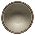 Ceramic bowl with brown rim on a white background
