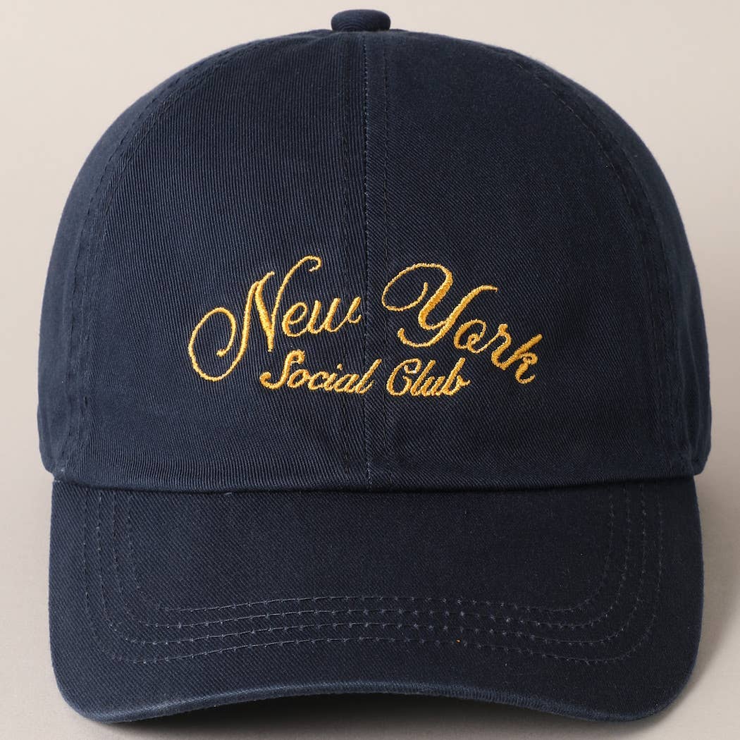 Beige and navy New York Social Club embroidered baseball caps with curved brims.