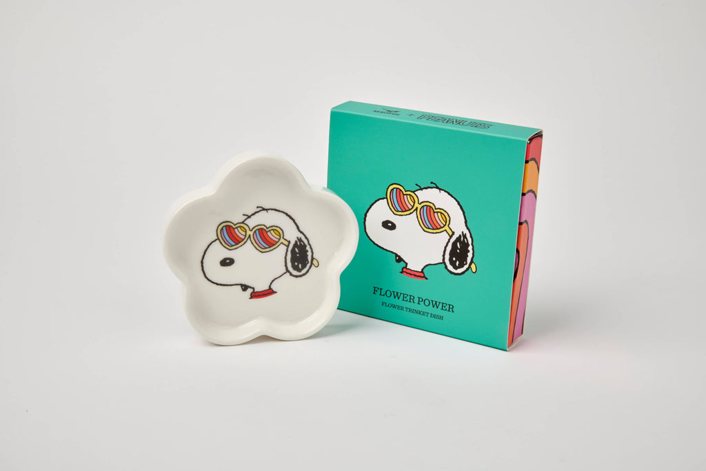 Flower-shaped ceramic trinket dish featuring a black-and-white beagle wearing rainbow heart sunglasses, paired with a teal gift box.