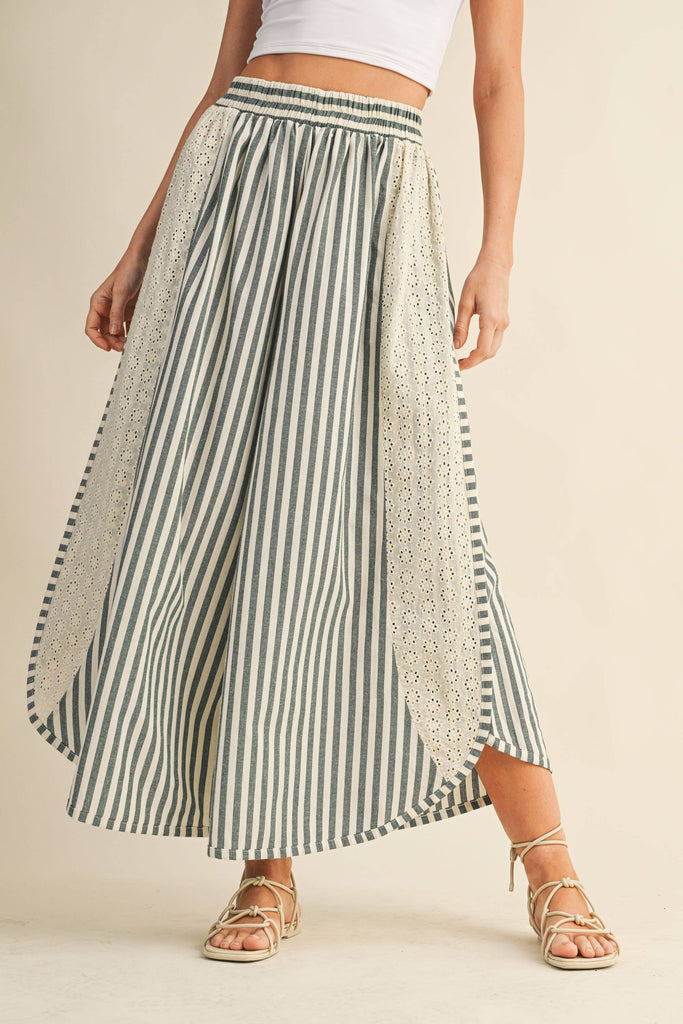 Striped wide-leg pants with floral eyelet side panels and elastic waistband, styled with a white crop top