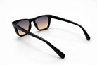 Black sunglasses with gradient lenses on a white background