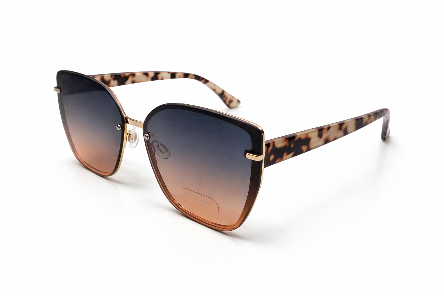 Sunglasses with tortoiseshell frame and gradient lenses on a white background
