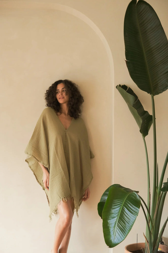 A woman gracefully wearing the Ava Kimono, showcasing its flowing silhouette, delicate patterns, and high-quality fabric.A woman gracefully wearing the Ava Kimono, showcasing its flowing silhouette, delicate patterns, and high-quality fabric.