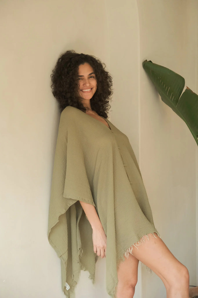 A woman gracefully wearing the Ava Kimono, showcasing its flowing silhouette, delicate patterns, and high-quality fabric.