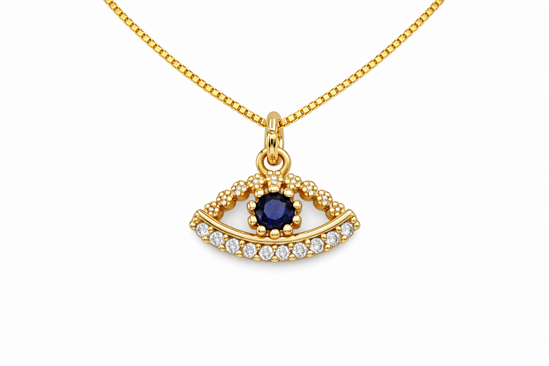 Gold necklace with an eye-shaped pendant featuring a blue gemstone on a white background