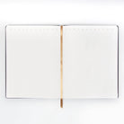 A front-view image of the 'Bad Ideas Journal', showcasing its sturdy construction and vintage design.