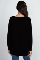 Vanessa Sweater showcasing its soft and luxurious fabric with a ribbed pattern, perfect for a stylish and comfortable outfit.
