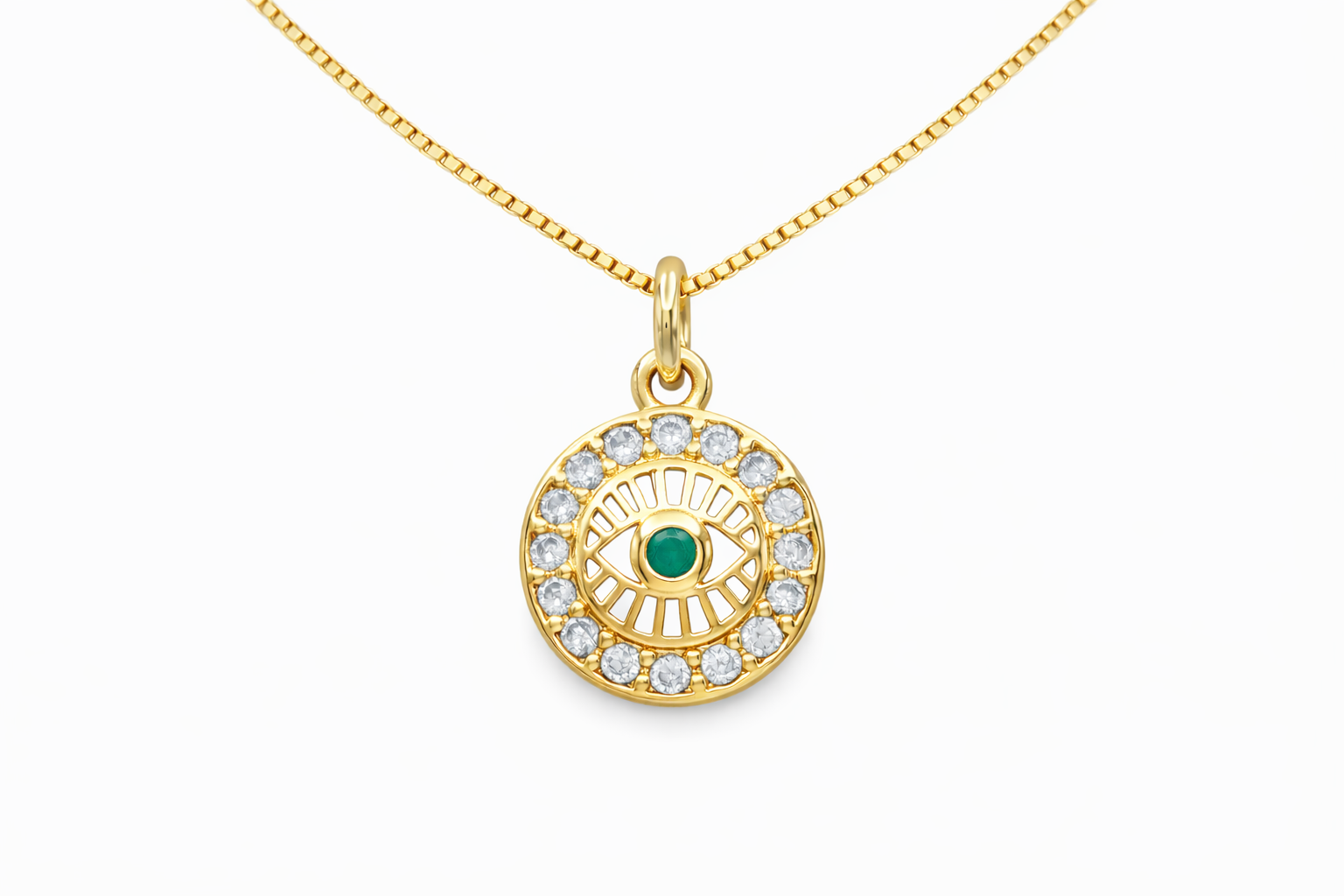 Gold necklace with an eye-shaped pendant on a white background
