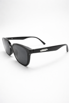 Black sunglasses with a brand logo on a white background