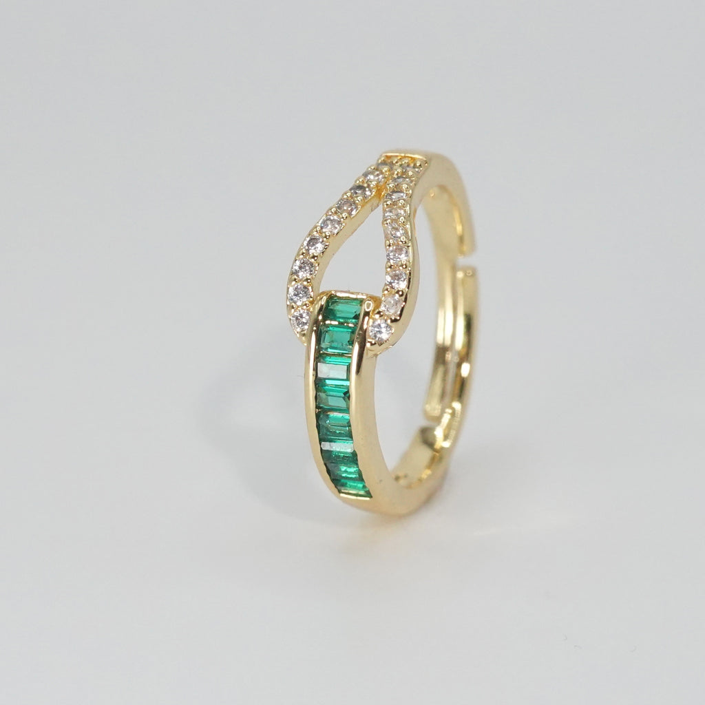 Broadway Ring: Sparkling green stones adorn this glamorous piece, epitome of elegance.