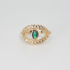 Glenneyre Ring: Eye-shaped design with shimmering stones and a striking green centerpiece, epitome of allure.