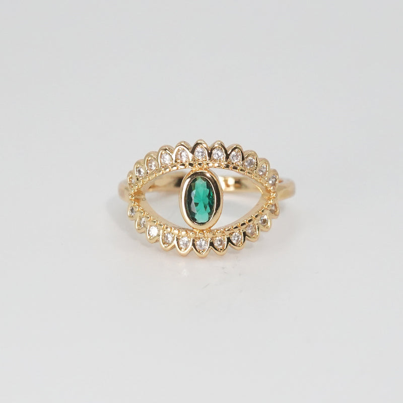 Glenneyre Ring: Eye-shaped design with shimmering stones and a striking green centerpiece, epitome of allure.