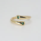 Thalia Ring: Twin mesmerizing green stones, epitome of elegance.