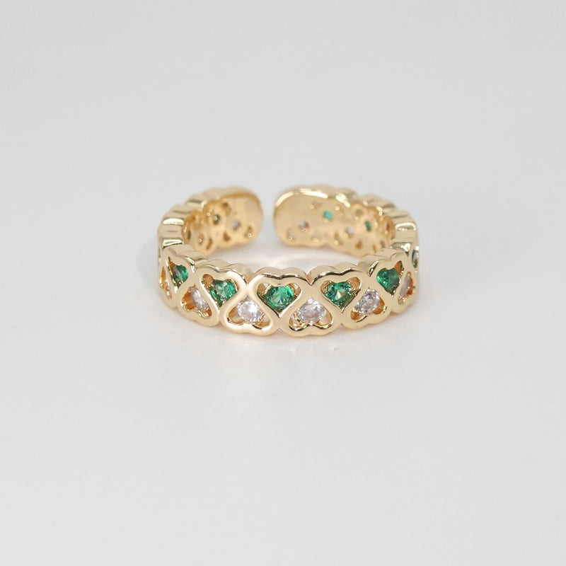 Lagoon Ring: Heart-shaped designs with shimmering stones and vibrant green accents, epitome of romance.