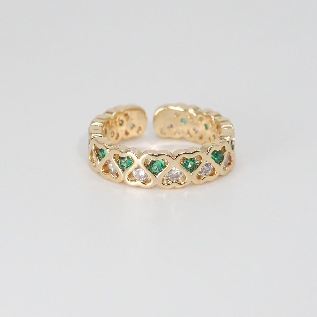Lagoon Ring: Heart-shaped designs with shimmering stones and vibrant green accents, epitome of romance.