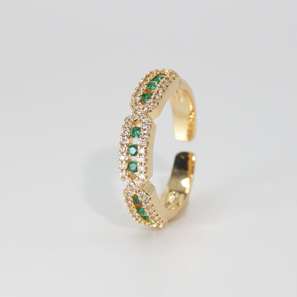 Calliope Ring: A captivating mix of green and shimmering stones, epitome of enchantment.