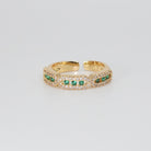 Calliope Ring: A captivating mix of green and shimmering stones, epitome of enchantment.