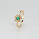 St. Ann's Ring: Shimmering stones encasing a striking square-shaped green centerpiece, epitome of sophistication.